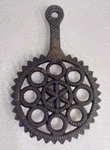 Vintage Wilton Black Cast Iron Trivet Circles Spikes And 6 Point Center Star 9". Fixed Price $11.77.