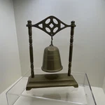 Bell Stand, Bronze Tone Metallic Finish, Handle, Art Theme. Fixed Price $19.50.
