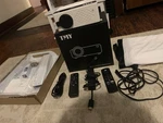 Projector, Amazon Firestick, Ceiling Mount, Screen, Remotes, And Wires Bundle. Fixed Price $49.00.
